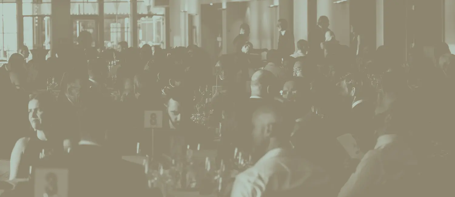 crowded tables with well-dressed people